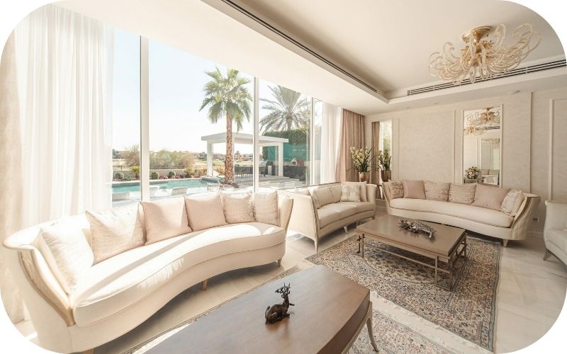 cream coloured villa interior, with sofa and tables